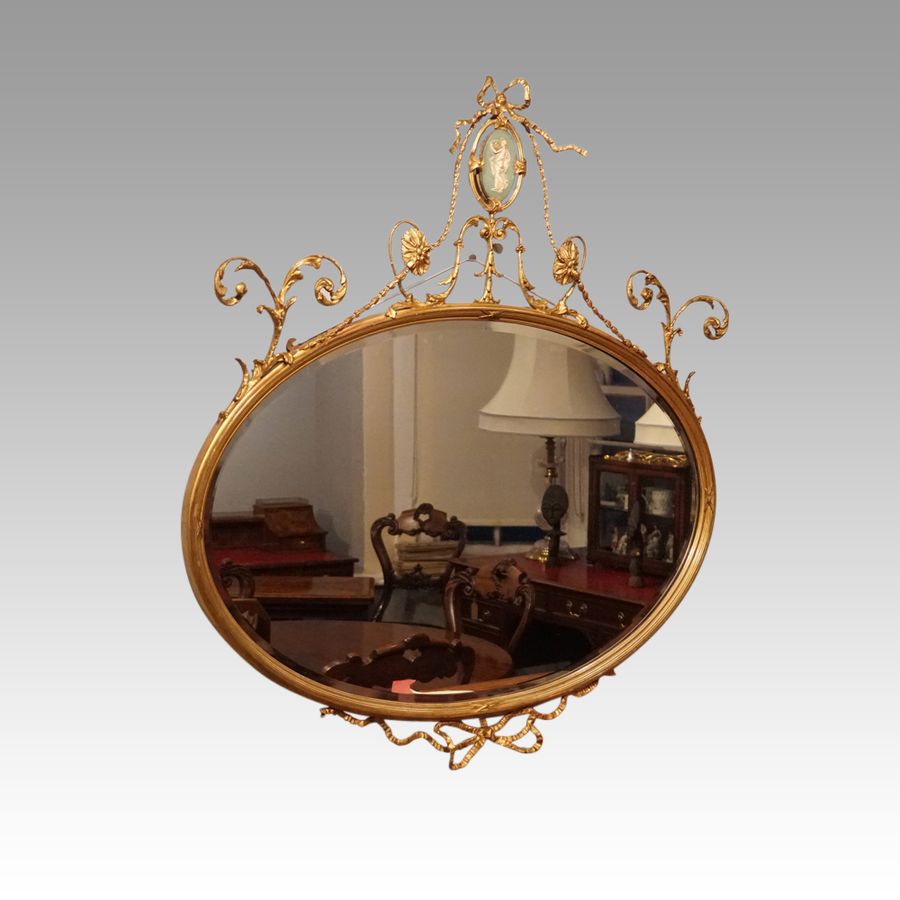 Antique Antique gilt mirror with Wedgwood plaque