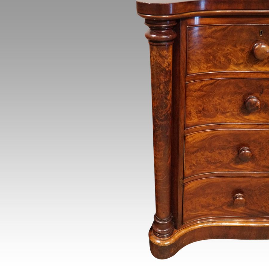 Antique Victorian mahogany serpentine chest