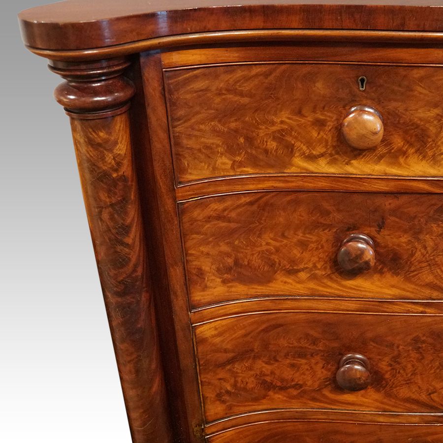 Antique Victorian mahogany serpentine chest