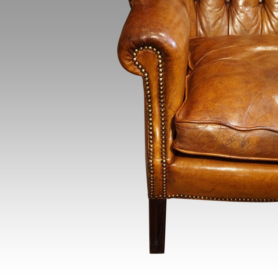 Antique George VI leather button back wingchair