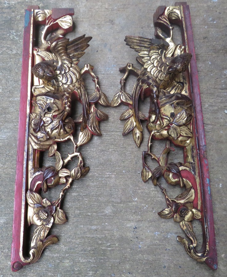 A Pair of Lacquered, Gilt and Openwork Birds Among Flora