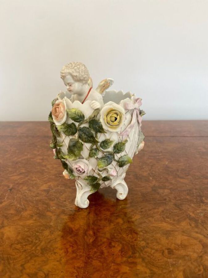Antique Antique Victorian quality continental porcelain cherub in a vase