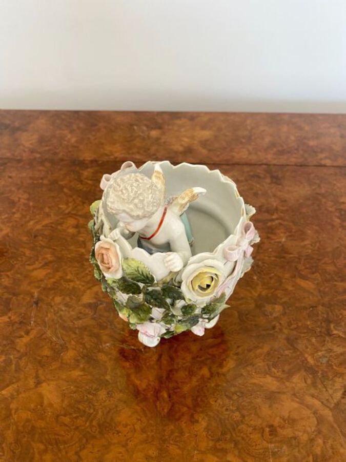 Antique Antique Victorian quality continental porcelain cherub in a vase