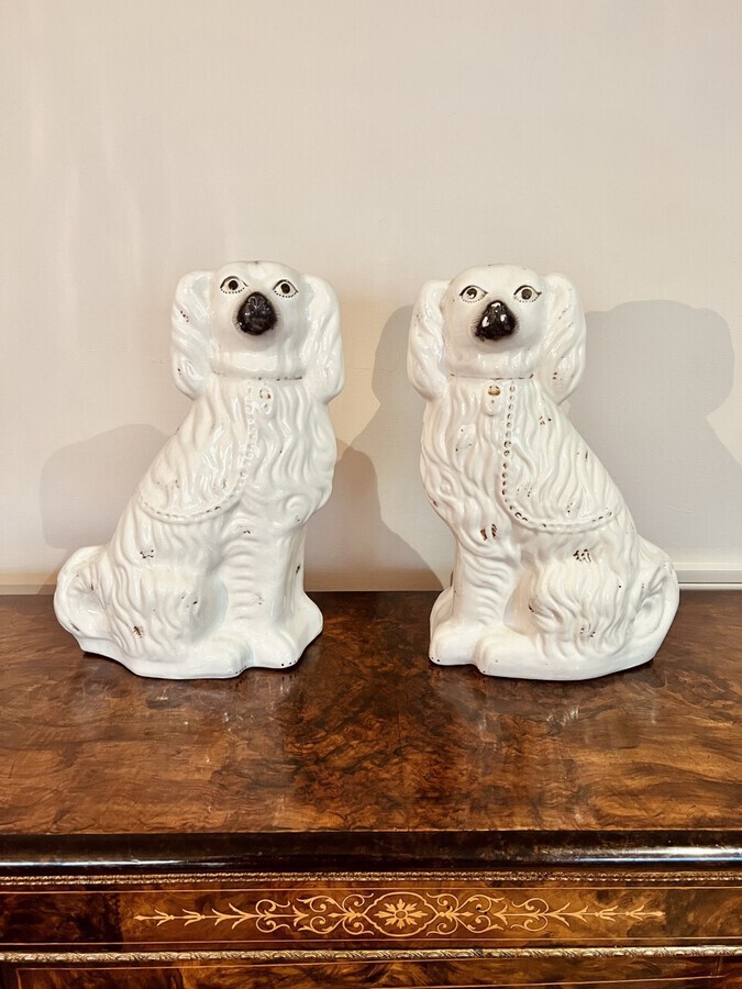 Large pair of Victorian seated Staffordshire spaniel dogs