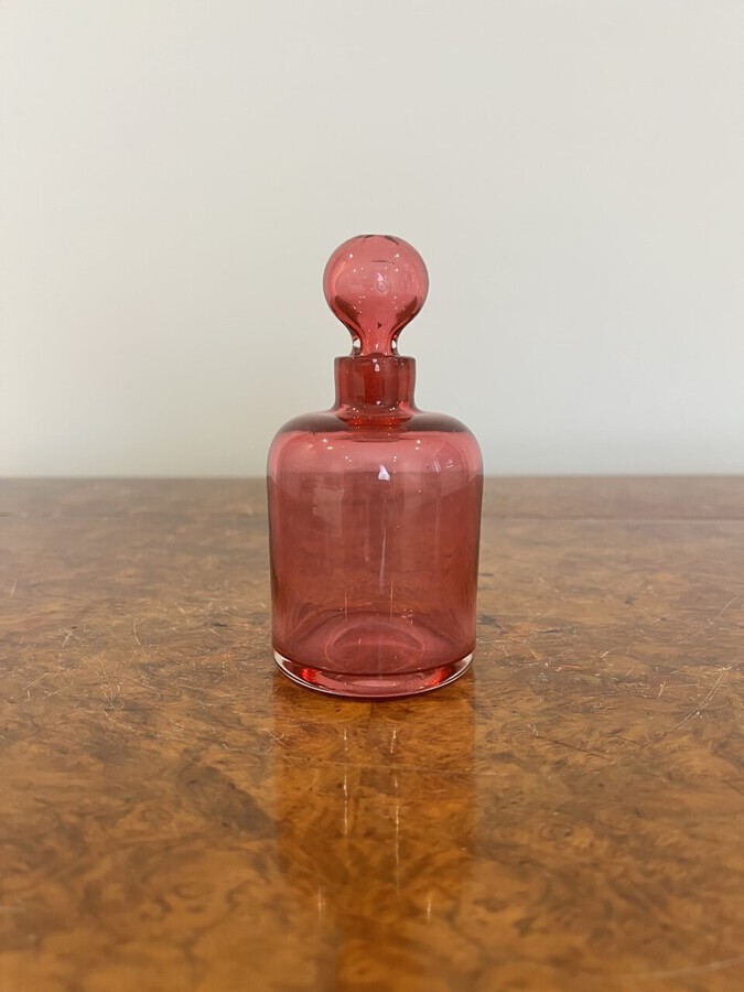Antique Victorian cranberry glass bottle