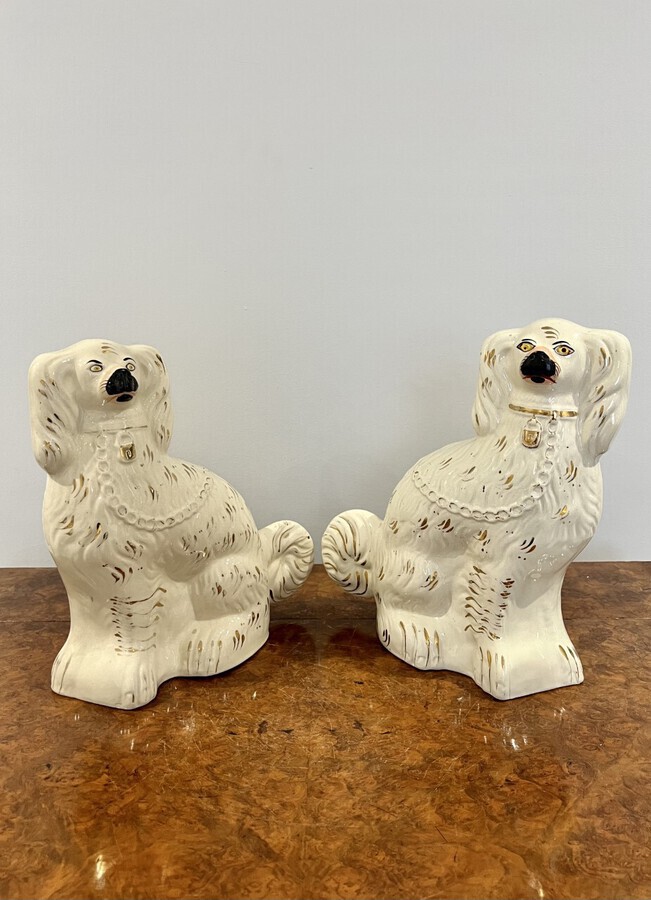 Antique Large pair of Victorian seated Staffordshire spaniel dogs