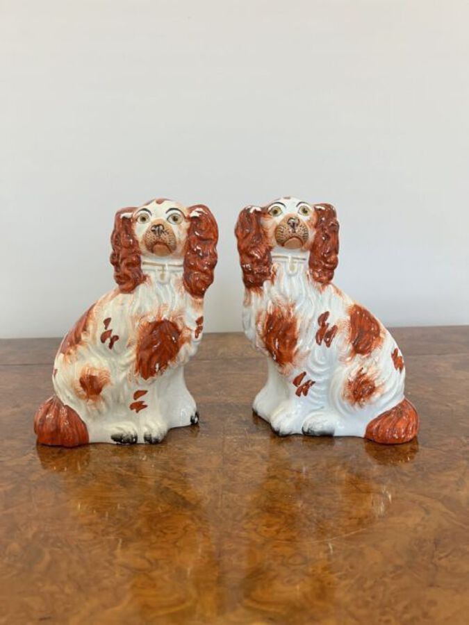 Quality pair of antique Victorian seated spaniels