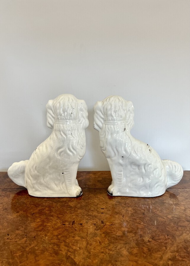 Antique Large pair of Victorian seated Staffordshire spaniel dogs