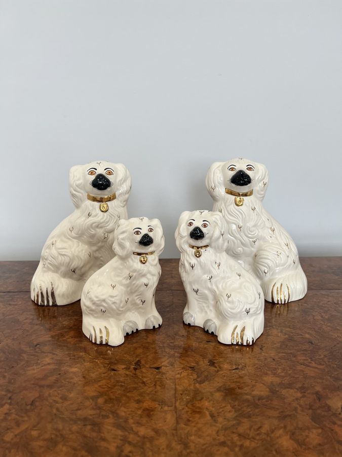Antique Collection of four quality Royal Dolton seated spaniels 