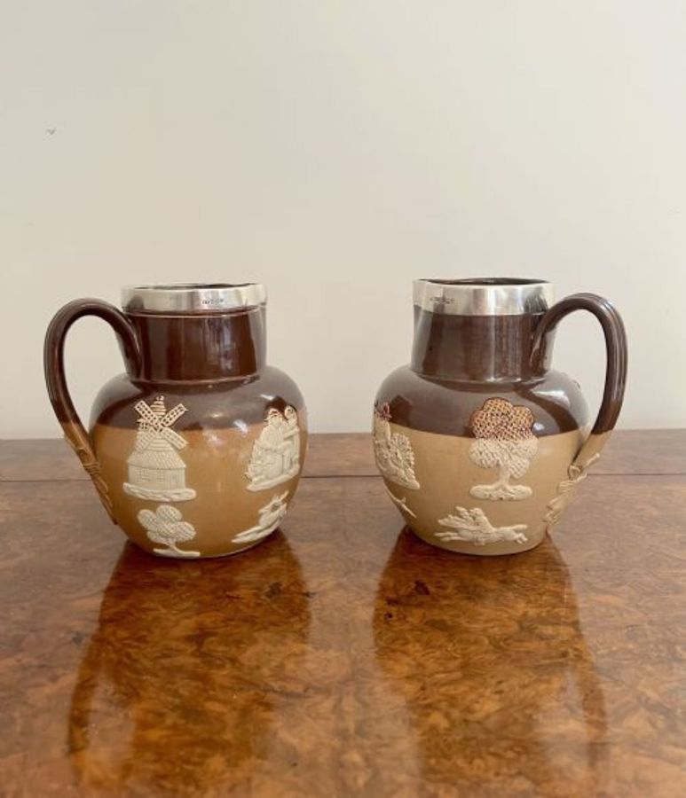 Antique Unusual pair of quality antique Doulton Lambeth harvest jugs with silver rims 