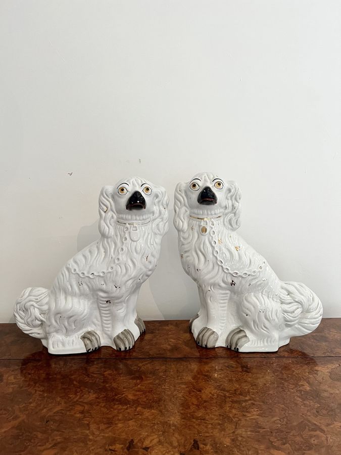 Large pair of Victorian seated Staffordshire spaniel dogs