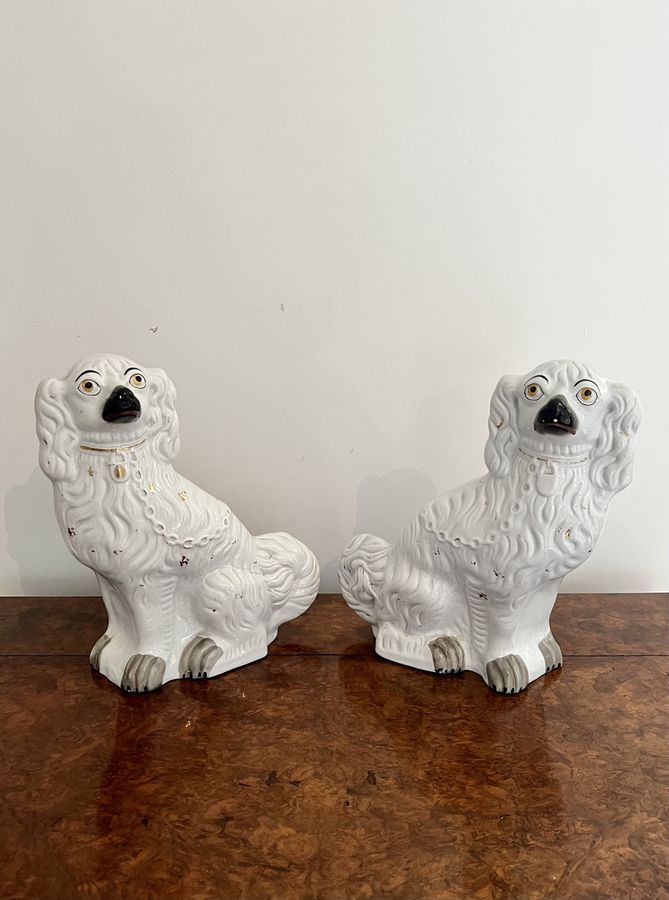 Antique Large pair of Victorian seated Staffordshire spaniel dogs