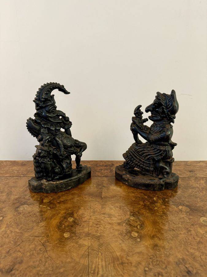 Antique Antique Punch and Judy cast iron door stops 