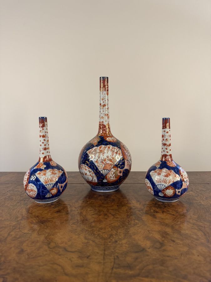 Outstanding quality garniture of three Japanese imari shaped vases