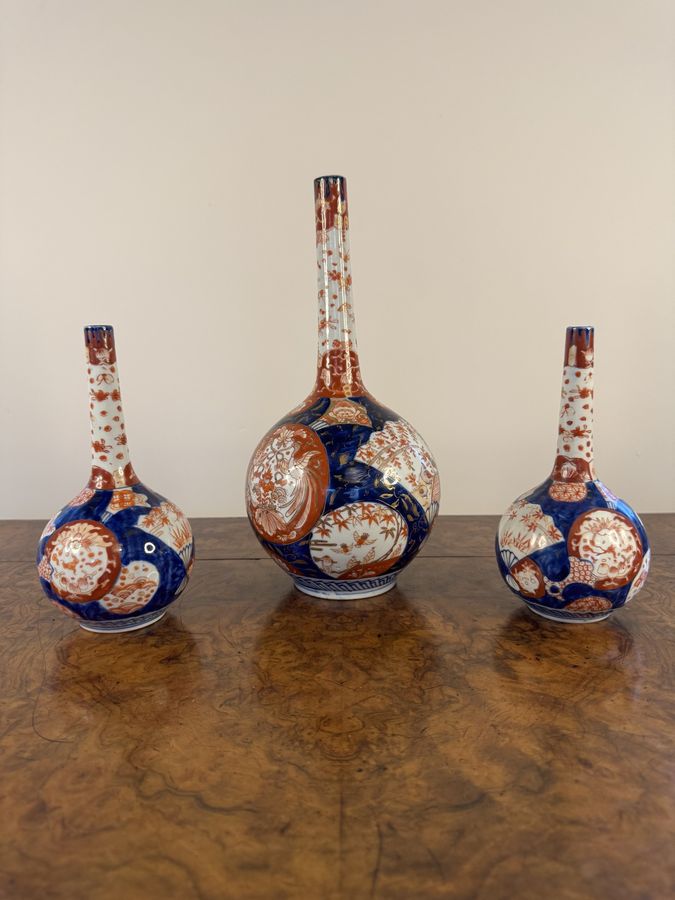 Antique Outstanding quality garniture of three Japanese imari shaped vases