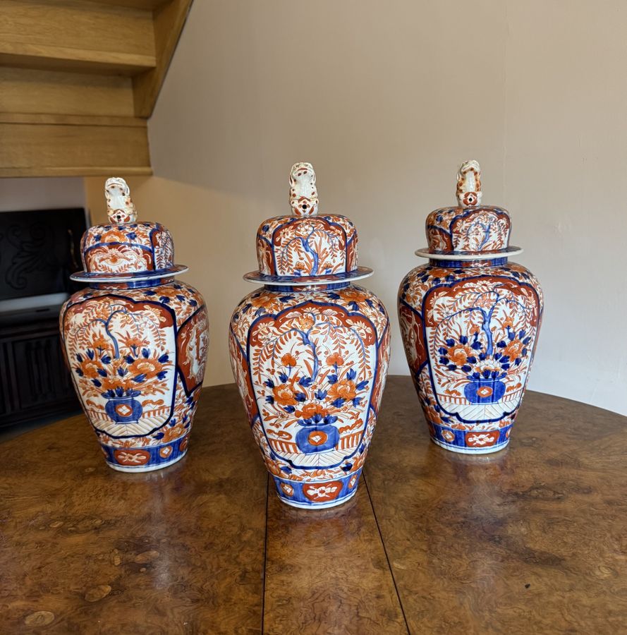 Antique Outstanding fantastic quality garniture of three antique Japanese imari vases and covers