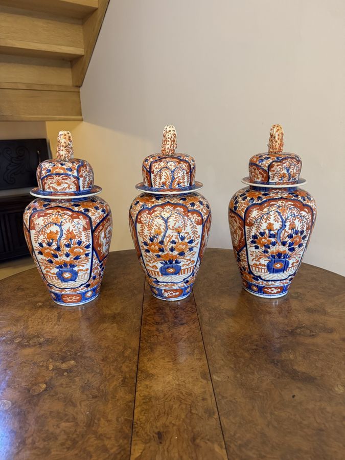 Antique Outstanding fantastic quality garniture of three antique Japanese imari vases and covers