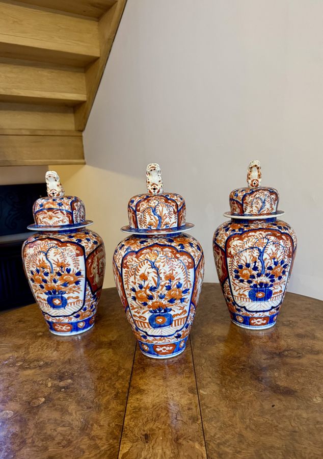 Antique Outstanding fantastic quality garniture of three antique Japanese imari vases and covers