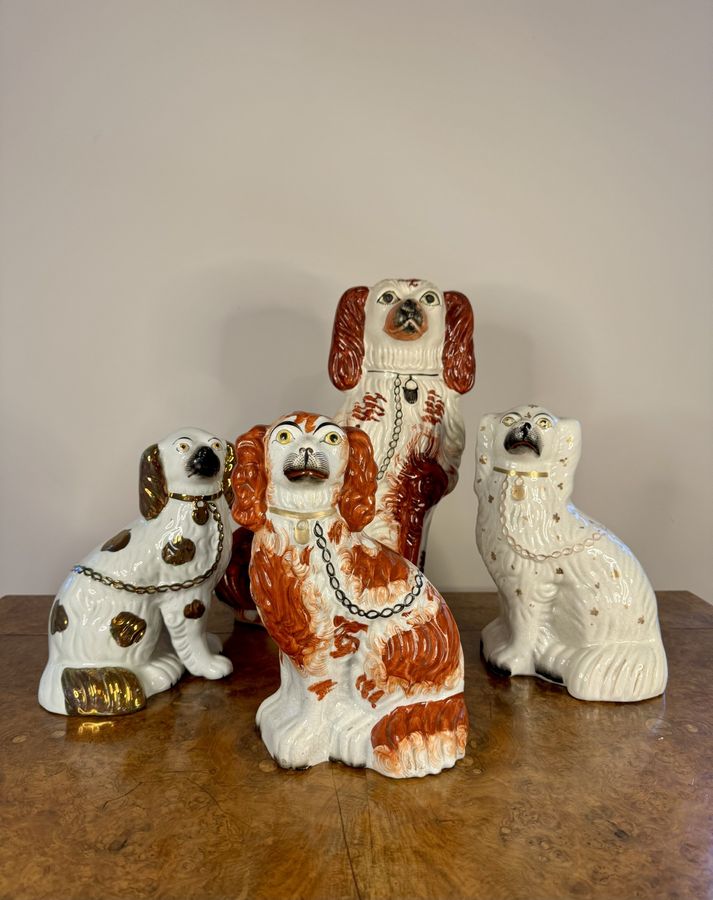 Quality collection of four antique Staffordshire dogs