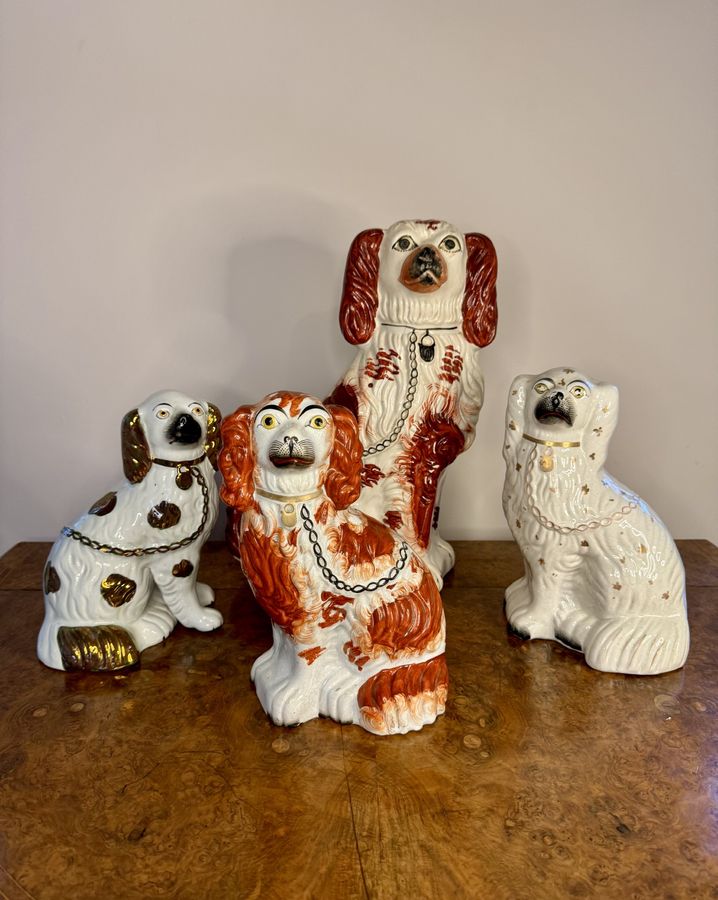 Antique Quality collection of four antique Staffordshire dogs