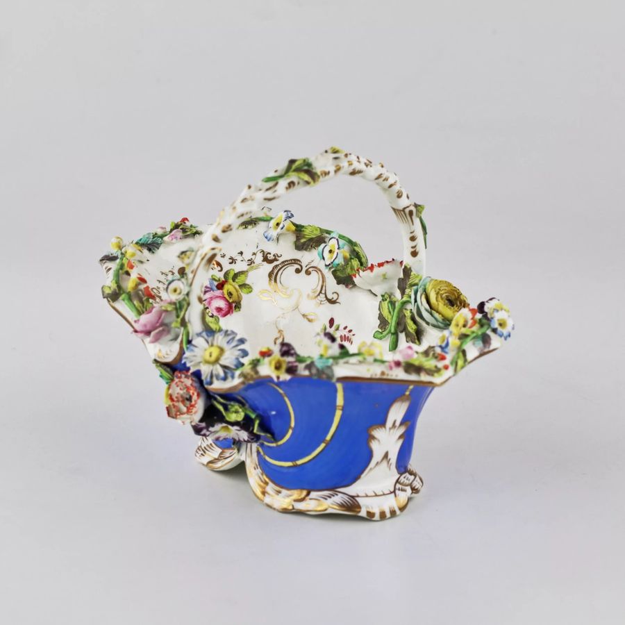 Antique Porcelain vase-basket with molded flowers.
