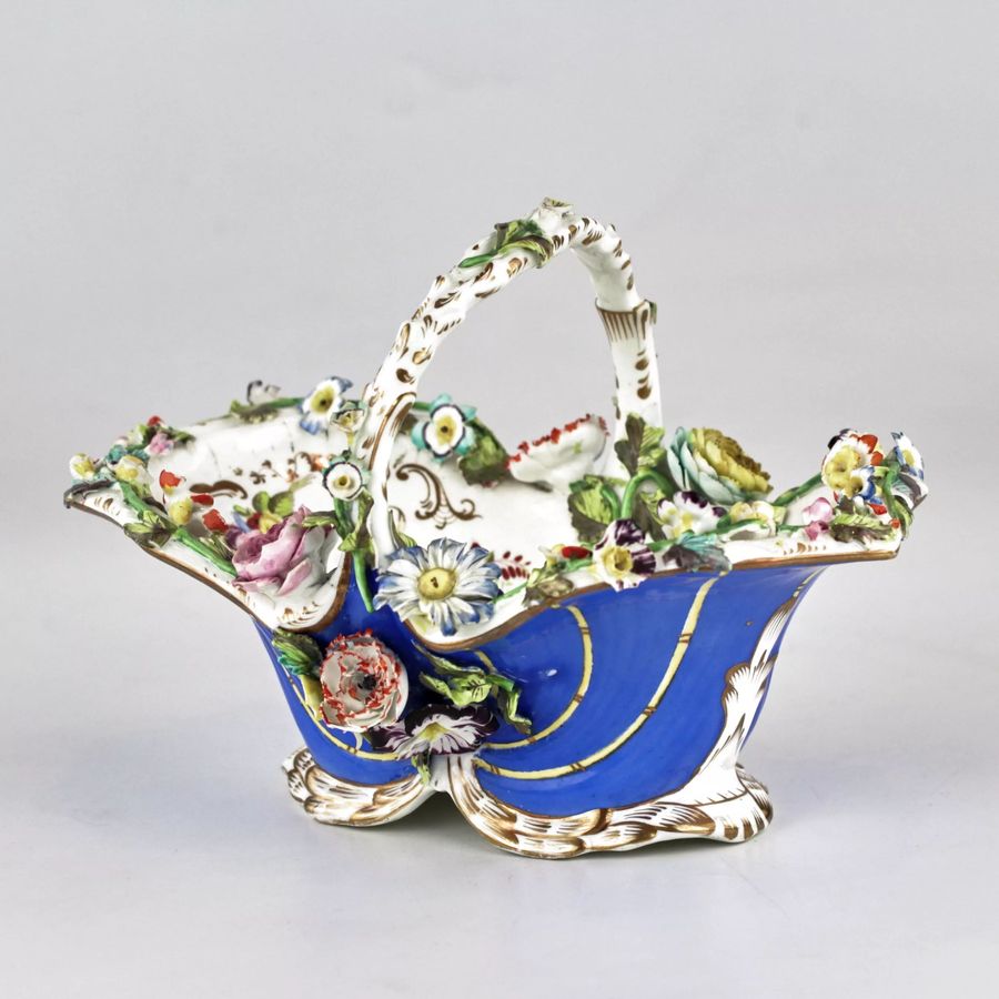 Antique Porcelain vase-basket with molded flowers.