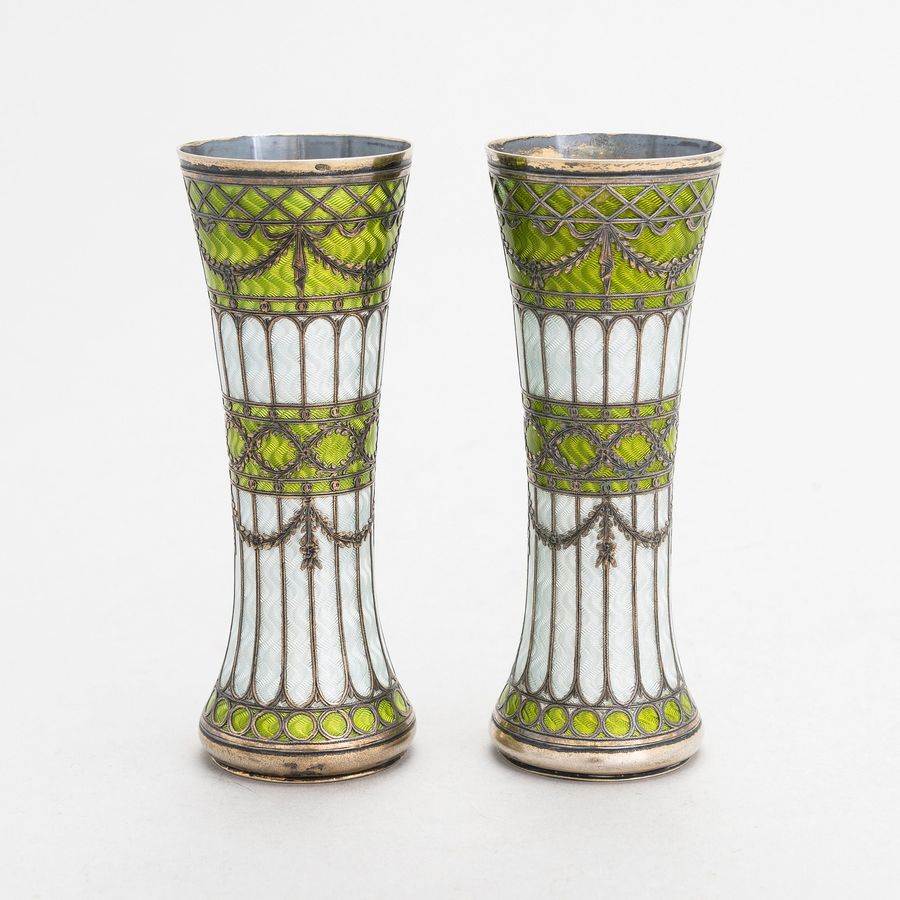 Antique A pair of vases-buds of gilded silver and guilloche enamel, early 20th century.