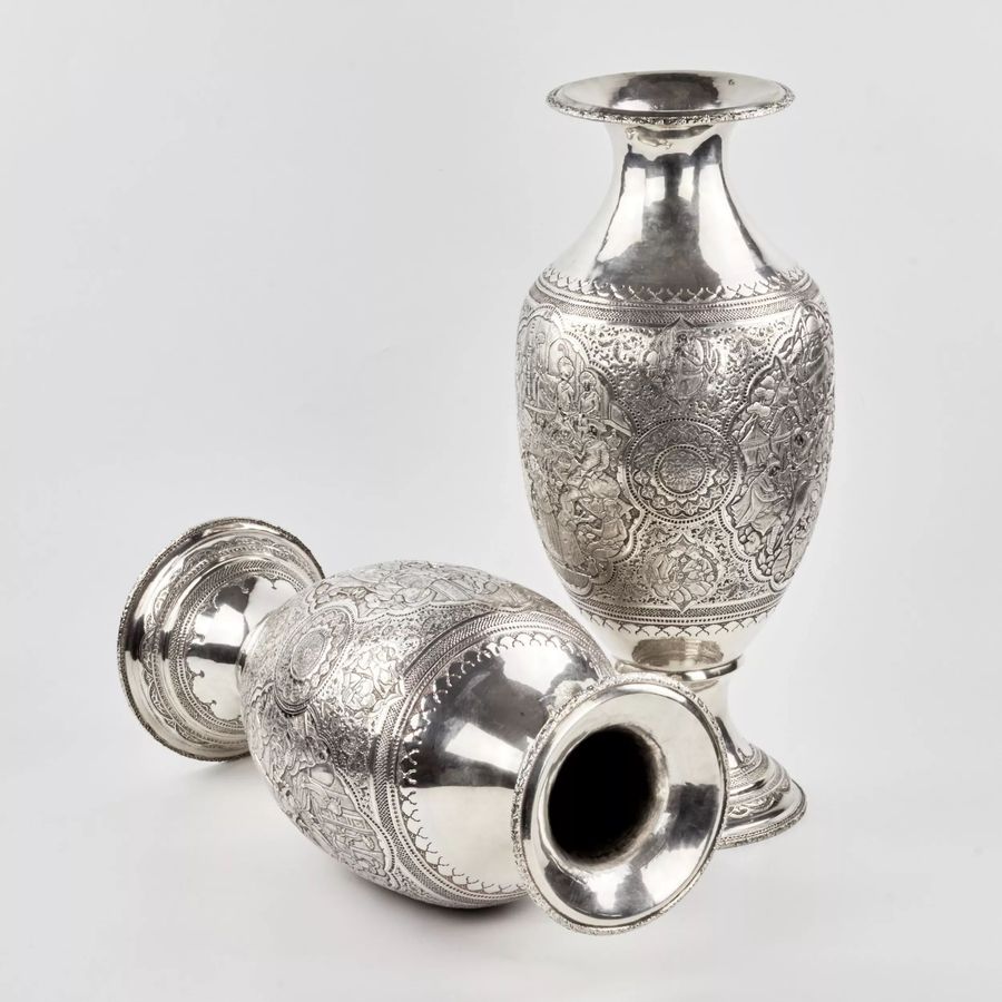Antique A pair of amphora-shaped Persian silver vases.