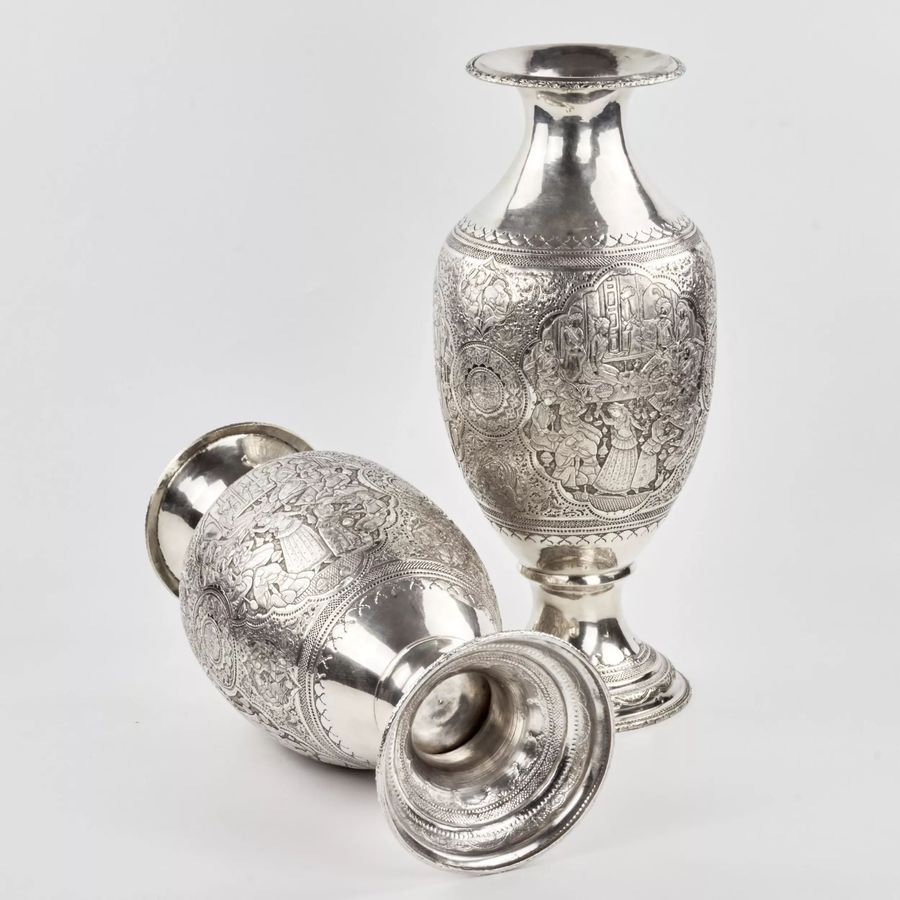 Antique A pair of amphora-shaped Persian silver vases.