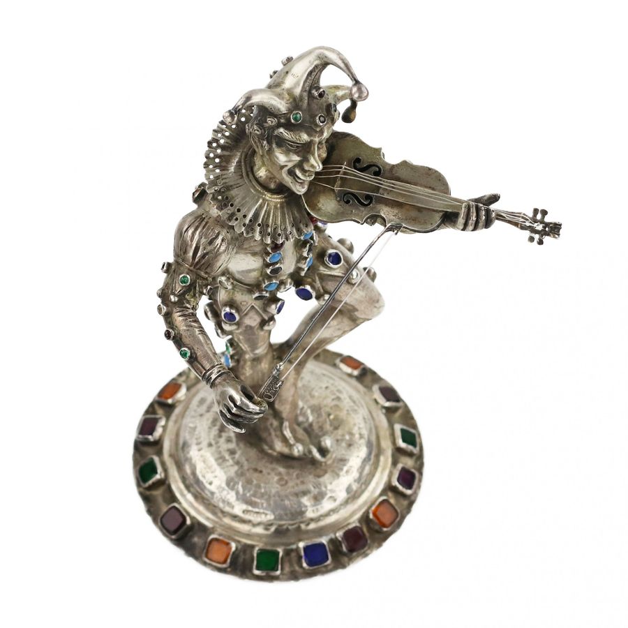 Antique Silver figure of a playing Harlequin. Germany. 19th century.