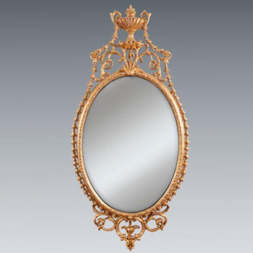 Antique An elegant George III giltwood and carton-pierre oval pier glass, late 18th Century