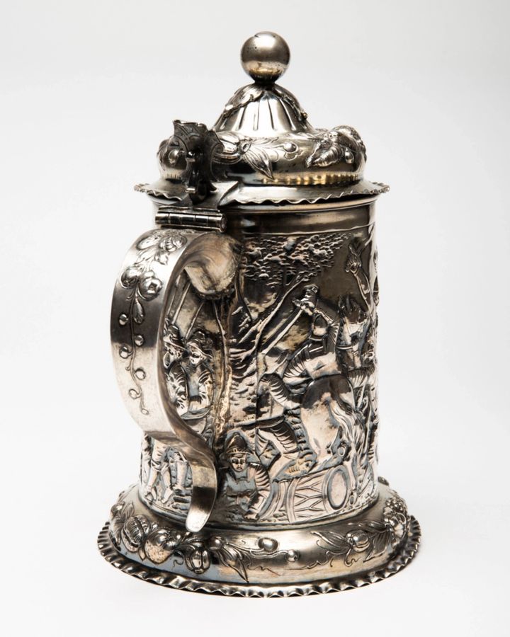 Antique Silver beer goblet with battle scenes. First half of the 19th century.