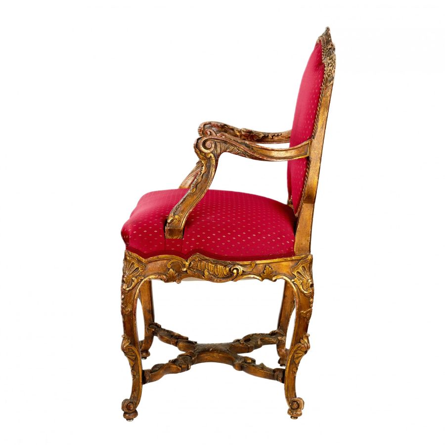 Antique Magnificent, carved chair in the Rococo style of the 19th-20th centuries.