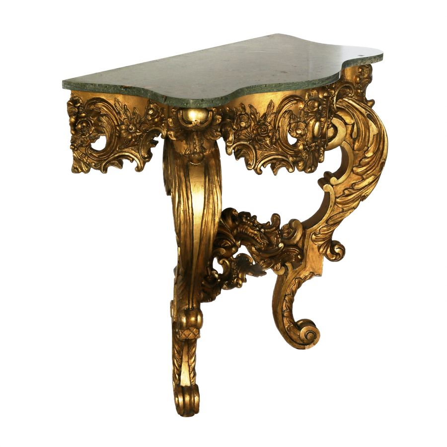 Antique Wooden, gilded console of the 19th century.