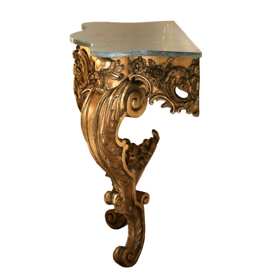 Antique Wooden, gilded console of the 19th century.