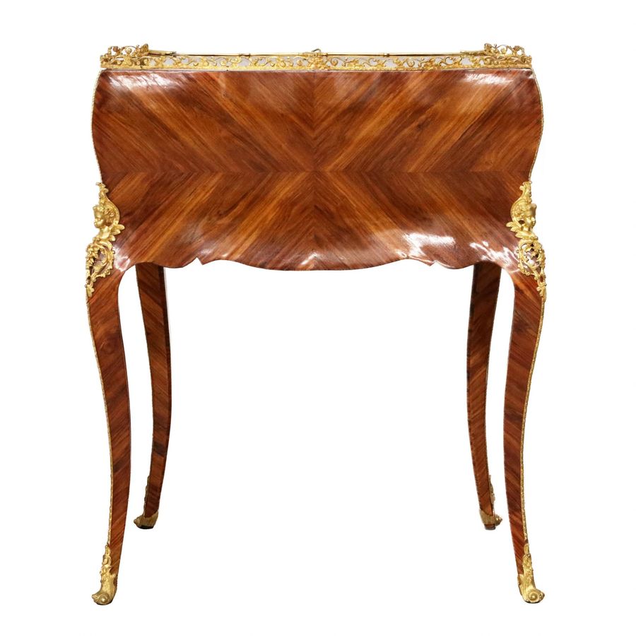 Antique Coquettish ladies` bureau in wood and gilded bronze, Louis XV style.