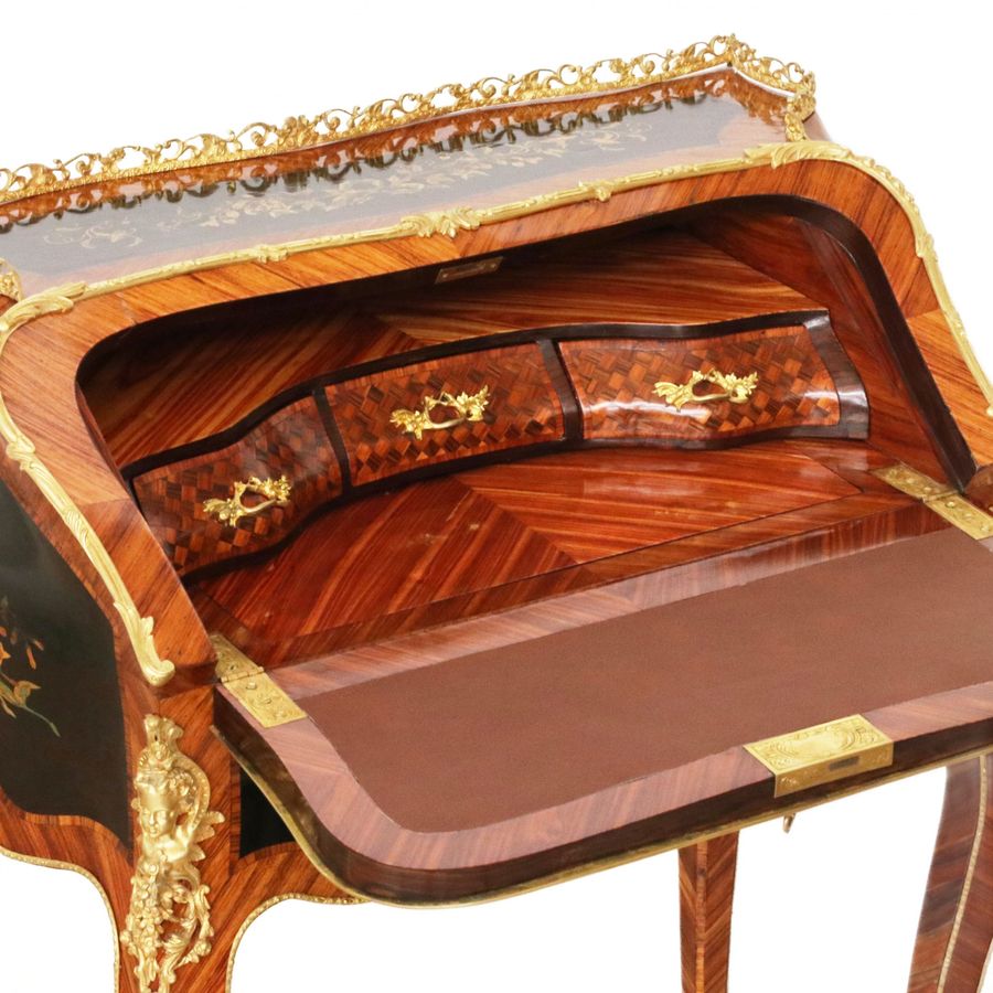 Antique Coquettish ladies` bureau in wood and gilded bronze, Louis XV style.