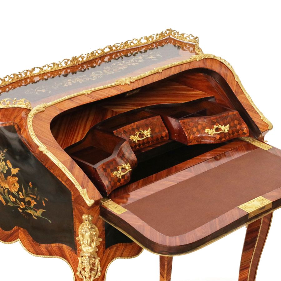 Antique Coquettish ladies` bureau in wood and gilded bronze, Louis XV style.