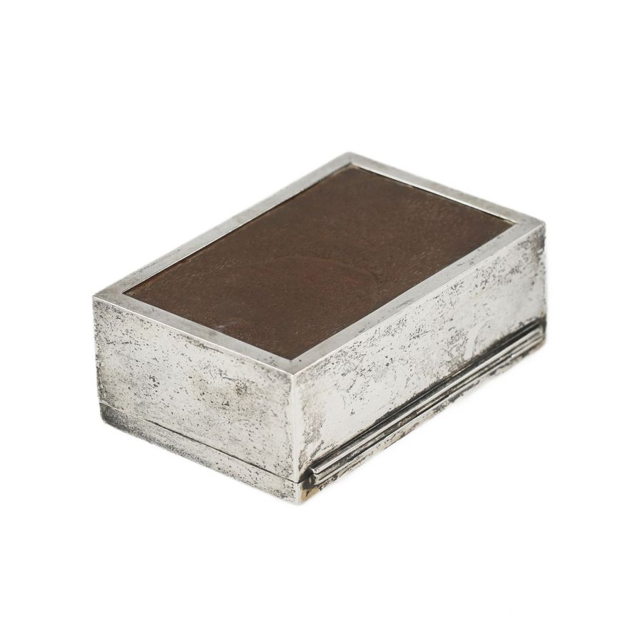 Antique Wooden box upholstered with silver-plated metal. 20th century.