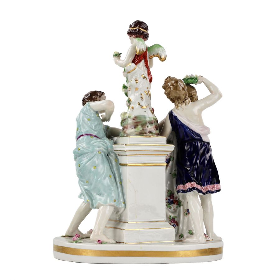 Antique Porcelain group Young people with Cupid.