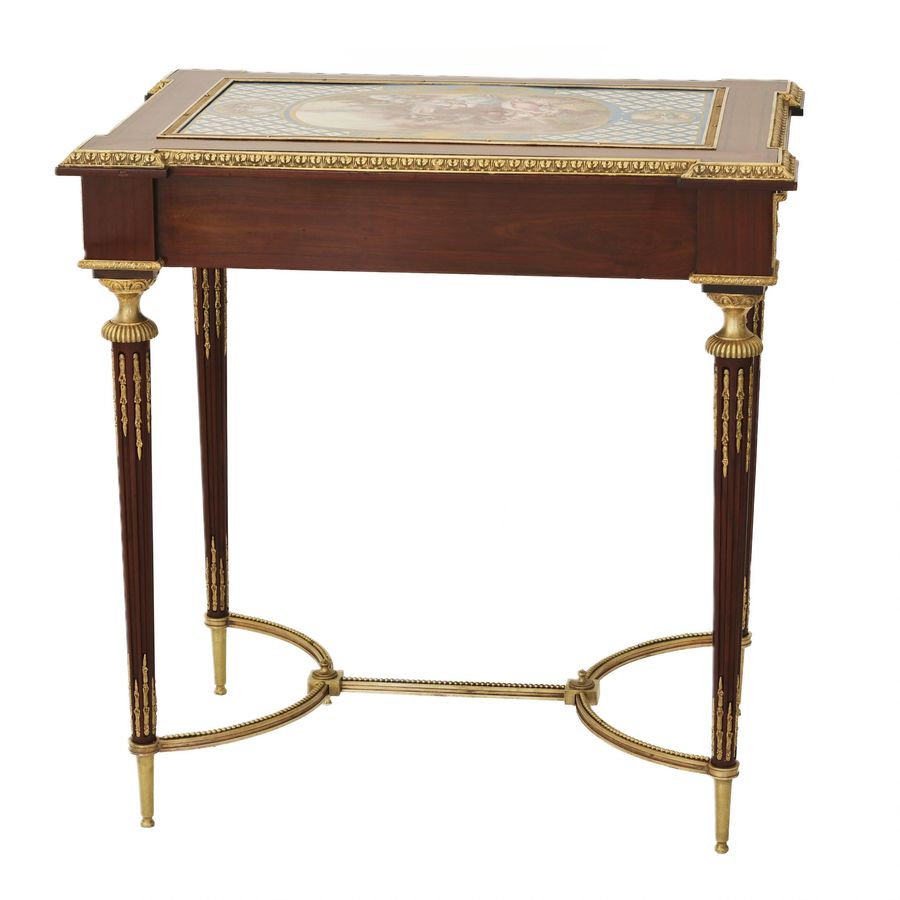 Antique A magnificent ladies table with gilded bronze decor and porcelain panels in the style of Adam Weisweiler. France. 19th century