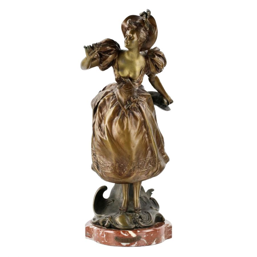 Antique French, bronzed metal figure on a marble base. Happy holiday.