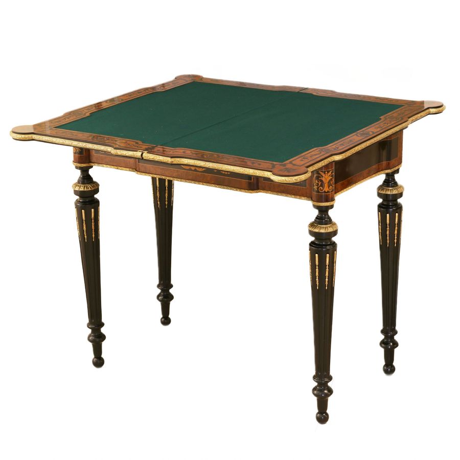 Antique Gaming table decorated with a pattern using marquetry technique. France. Late 19th century