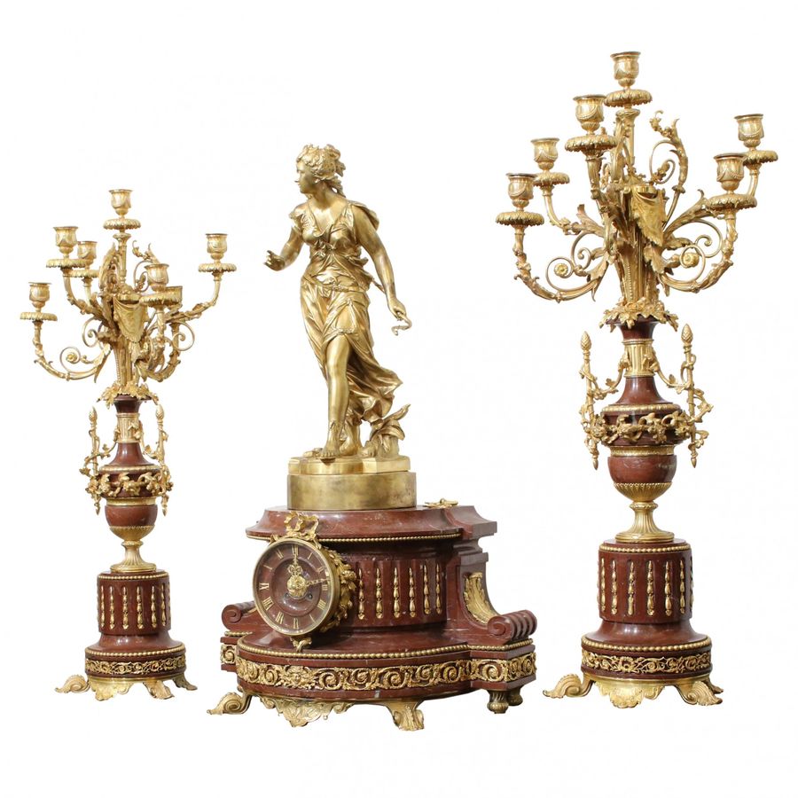 Antique Bronze fireplace clock set with candelabra.