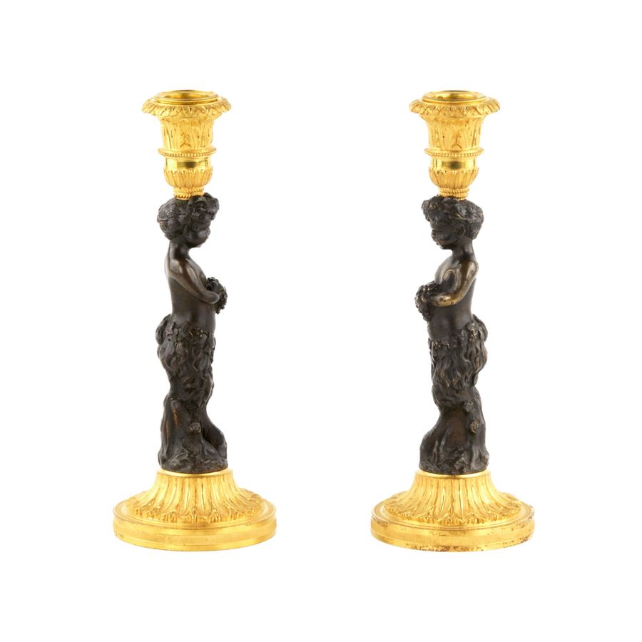 Antique Pair of bronze, French candlesticks, in the form of fauns, mid-19th century.