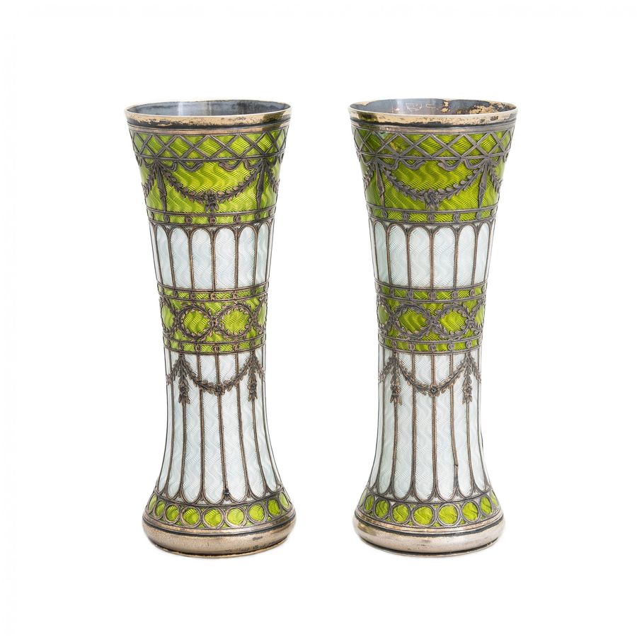 A pair of vases-buds of gilded silver and guilloche enamel, early 20th century.