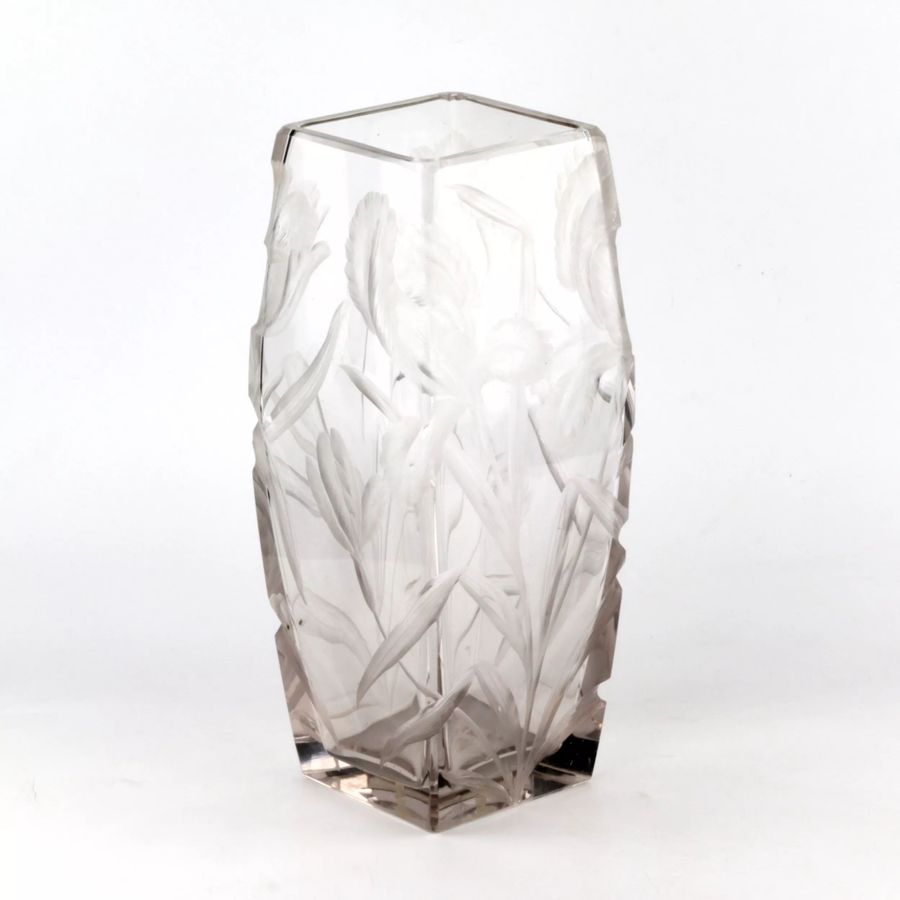 Large, heavy, crystal vase with luxurious irises.