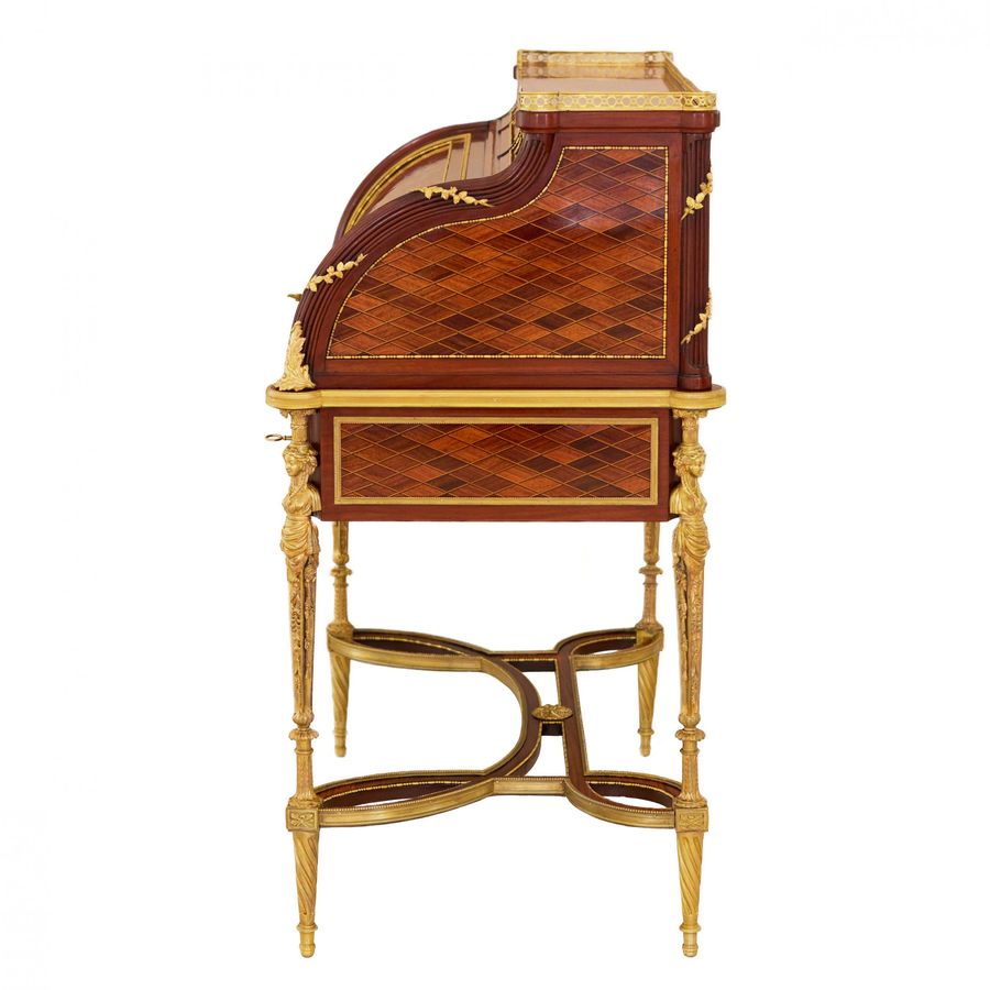 Antique E.KAHN. A magnificent cylindrical bureau in mahogany and satin wood with gilt bronze.