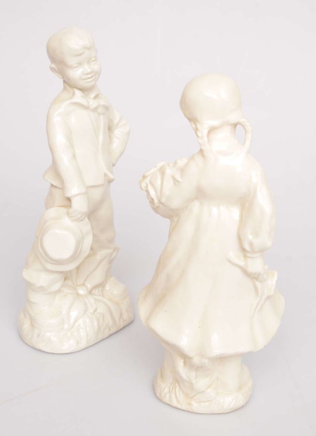 Antique Pair of porcelain figures Girl and boy