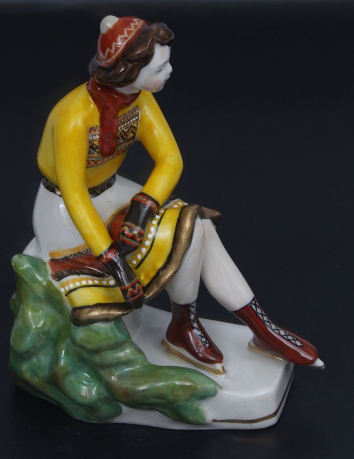 Antique Porcelain figurine ``Girl with skates``